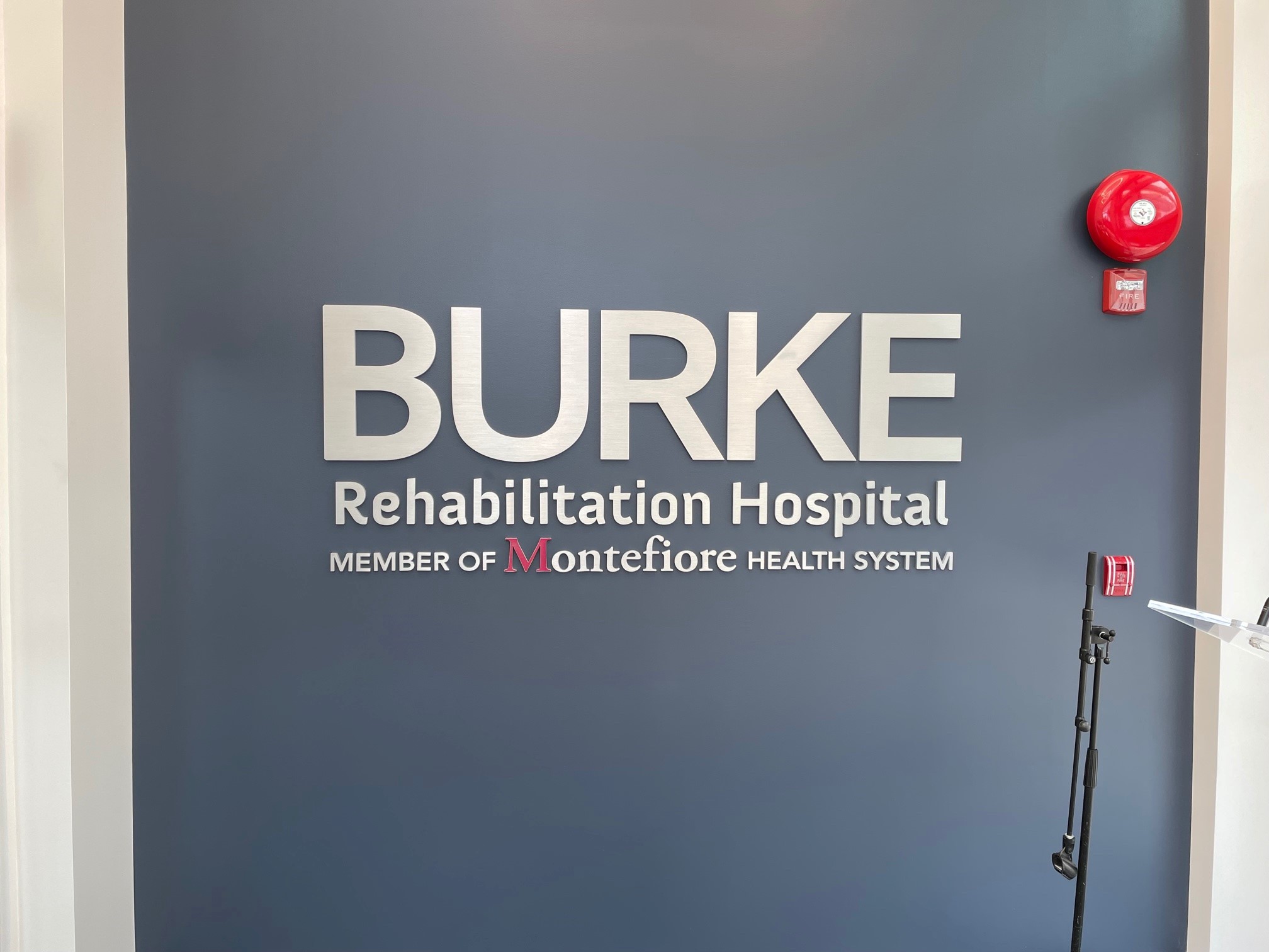 Burke Rehabilitation Hospital’s identity in dimensional letters at the building’s entrance